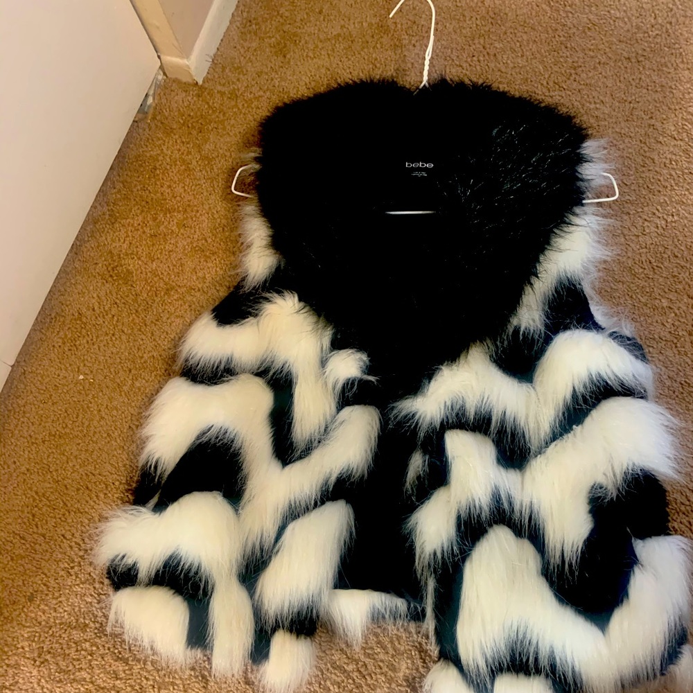 A black and white fur Bebe vest.